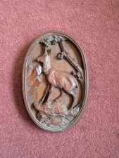 Wooden antique wall plaque featuring a deer