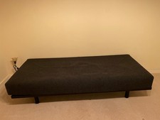 Lovely Habitat  Metal Daybed With Dark Grey Cushion.