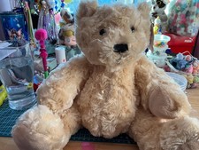 plush brown teddy bear with