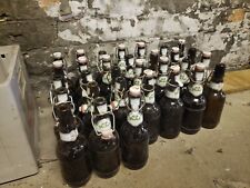 31 Grolsh Bottles, ceramic flip top and crate