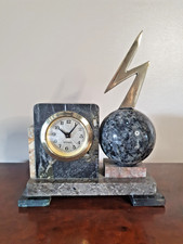 A UNUSUAL MANTEL CLOCK by