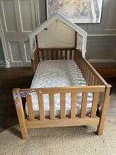 Child’s wooden canopy bed
