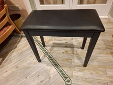 Modern piano stool black with under-seat storage for sheet music