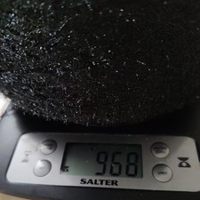 Black sparkling yarn on cone