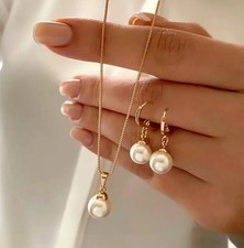 White faux pearl necklace and - faux,