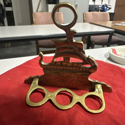 Vintage brass pipe rack in - a,