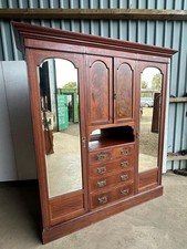 A Victorian mahogany mirror door wardrobe