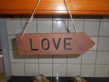 WOODEN HANDMADE ARROW HANGING SIGN WITH THE WORD LOVE ROUTERED