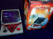 COLLECTABLE GRANDSTAND STARFORCE LCD GAME IN EXCELLENT CONDITION WITH BOX