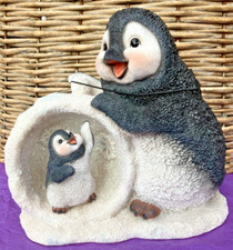 Penguin And Baby In Snowball