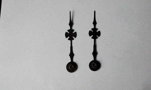 Two maltese cross clock - two,