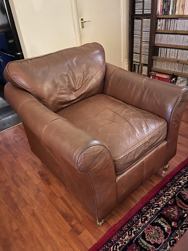 Old brown leather armchair - old,