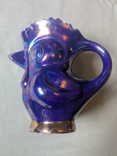 Jug: purple lustre and gilded ceramic jug in the form of a cartoon chicken