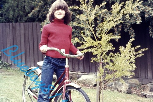 Child bike back garden - on,