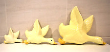 A Set Of Three Yellow Ceramic