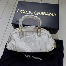 AN ORIGINAL DOLCE & GABBANA HANDBAG BOXED, GUARANTEE USED COUPLE OF TIMES BAG