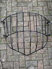 A Large Reclaimed Black Painted Wrought Iron Corner Hay Rack Planter