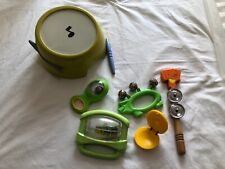 Toddler musical instruments inc. rattles, bells, hand symbols, drum with sticks
