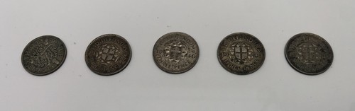 Three pence coins - three,