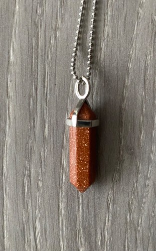 Goldstone bullet pendant