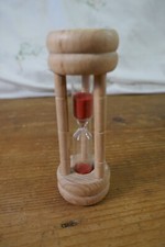 A small wooden Egg Timer with
