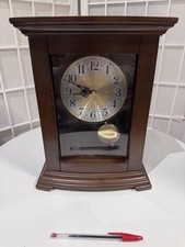 Wooden mantel clock with a