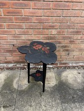 A black and red flower vintage side table