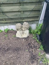 Don’t blink, don’t even blink. Garden statue, two Cherubs kissing.
