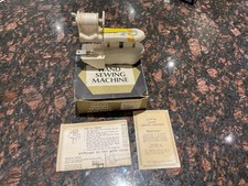 VINTAGE AND IN THE ORIGINAL BOX WITH INSTRUCTIONS LORING HAND SEWING MACHINE..