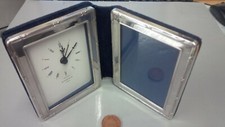 Silver hallmarked London 1995 'Kitney & Co' clock and photograph frame.