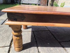 Myakka Style Coffee Table With Turned Legs And A Metal Banding