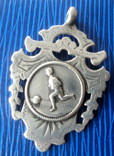 Early silver football medal - early,
