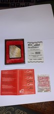 A Vintage Colibri Monomatic gas lighter gold tone with papers flint and box