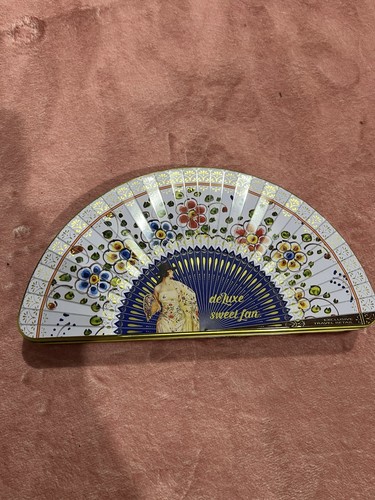 Empty fan shaped tin - empty,