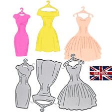 3 Retro Dresses On Hangers