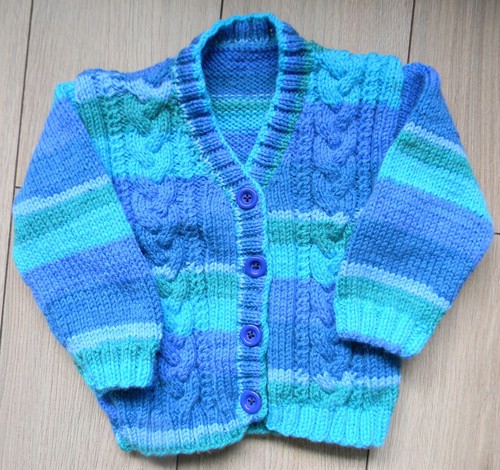 Hand knitted cable cardigan - hand,