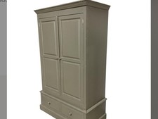 A PAINTED PINE LARDER CUPBOARD WITH TWO DRAWERS BELOW