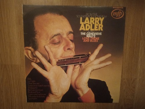 Larry adler plays the - plays,