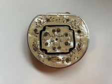 Unknown make of purse style powder compact.