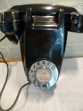 Vintage black Bakelite wall telephone with  numeric chrome rotary dial.Brilliant