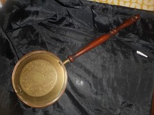 Old brass and copper warming