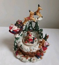 Musical Santa and Reindeer Flying Over Tree Tops We Wish You Merry Christmas 