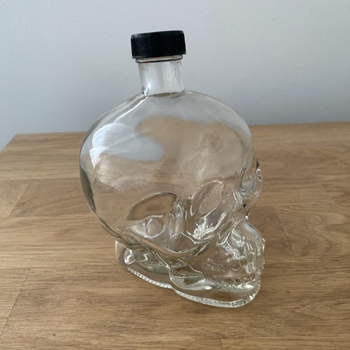 Empty glass skull - bottle, with