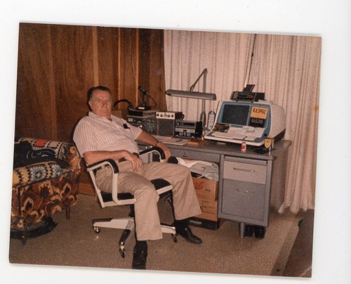 Man sitting ham radio work - at,