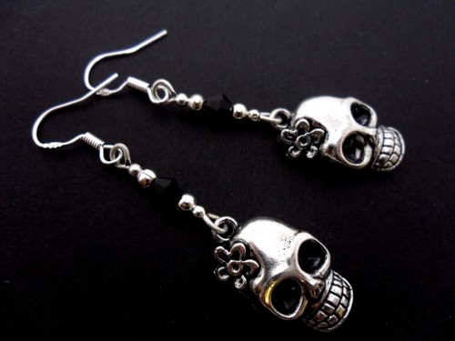 Pair tibetan silver skull - a, of