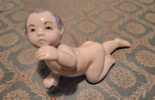 GLAZED PORCELAIN FIGURE OF A BABY-ROYAL COPENHAGEN.(UNMARKED)