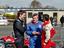 PHOTO  MICHAEL MALLOCK TIFF NEEDELL AND STUART BAIRD COMPARE NOTES IN PARC FERME