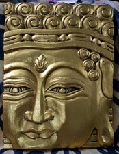 Hand carved buddha face - hand,