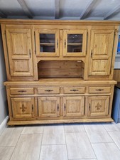 Solid oak dresser unit with solid drawers and glazed top cupboards.