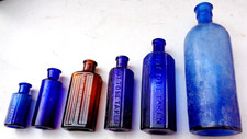 Six antique poison bottles - six,